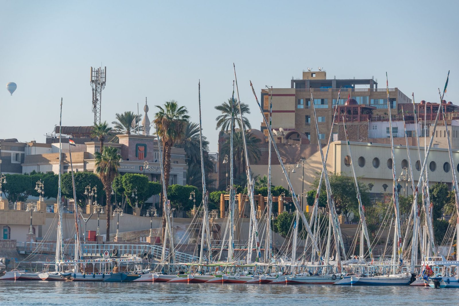 Feluccas and hot air balloon on the Luxor corniche